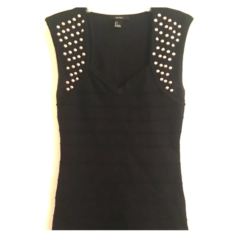 Short black form fitting club style dress.